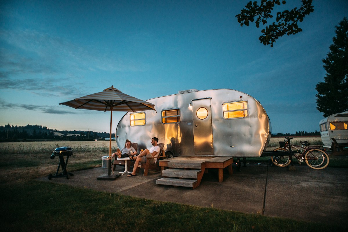 Luxury campervan glowing at dusk