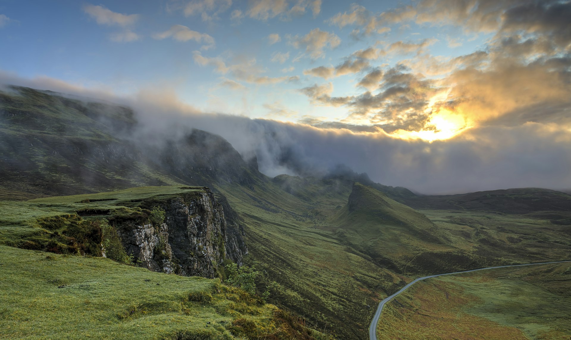 Sunrise over a misty mountain valley